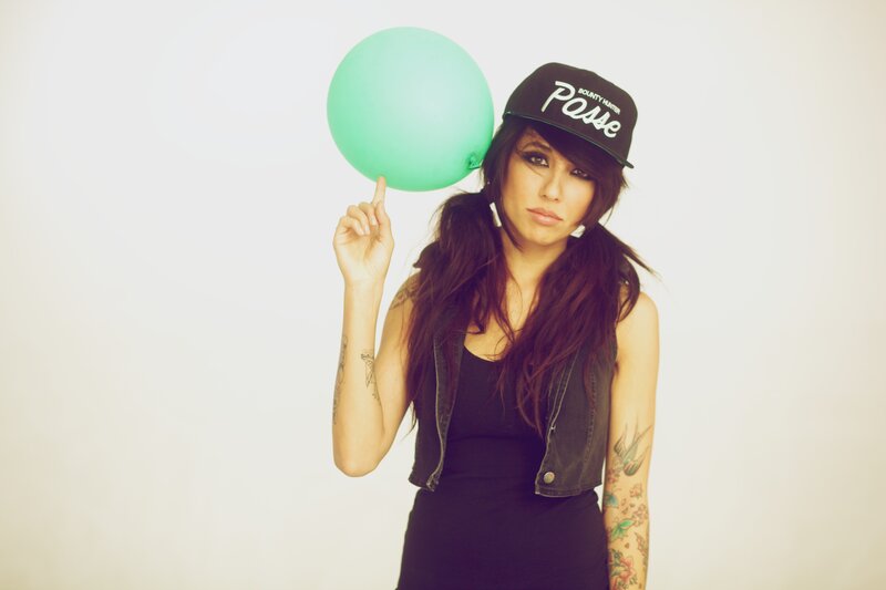 woman with balloon and cap