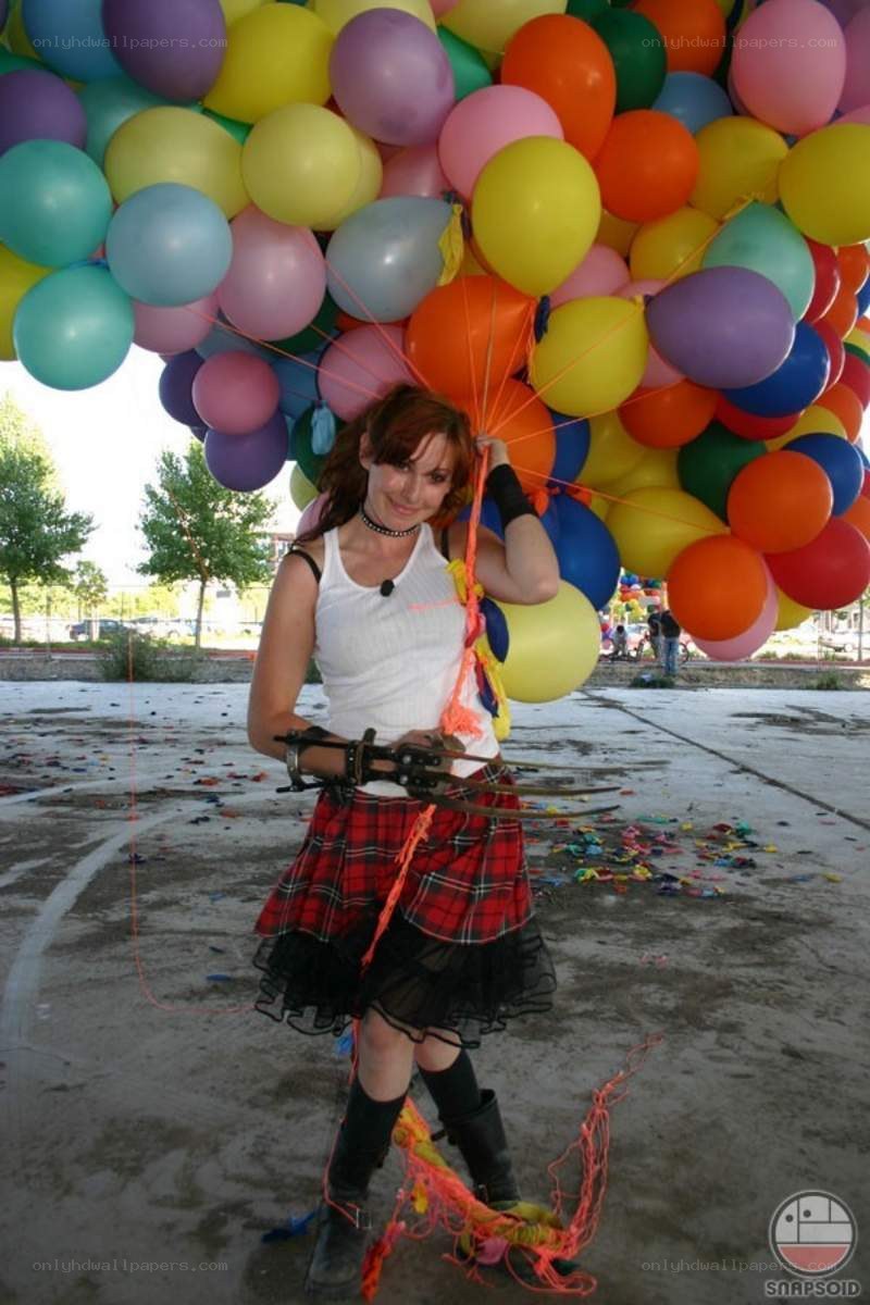 Woman with balloons and bow
