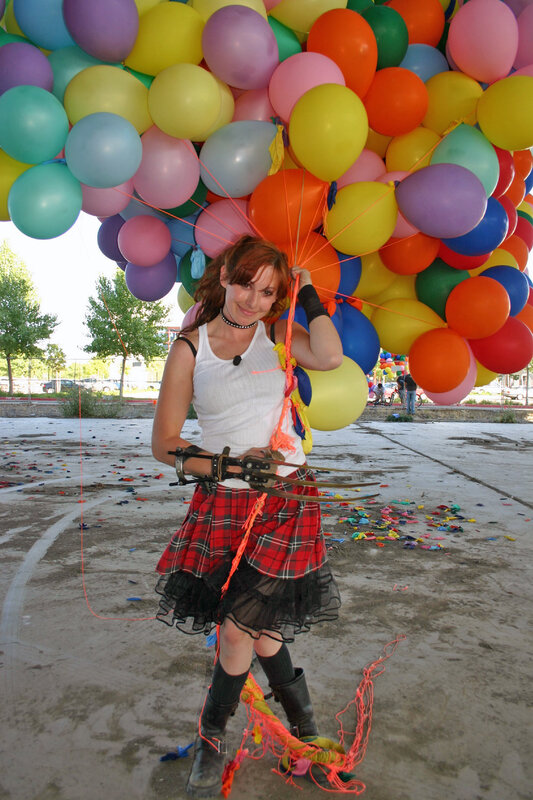 Woman with balloons and claws