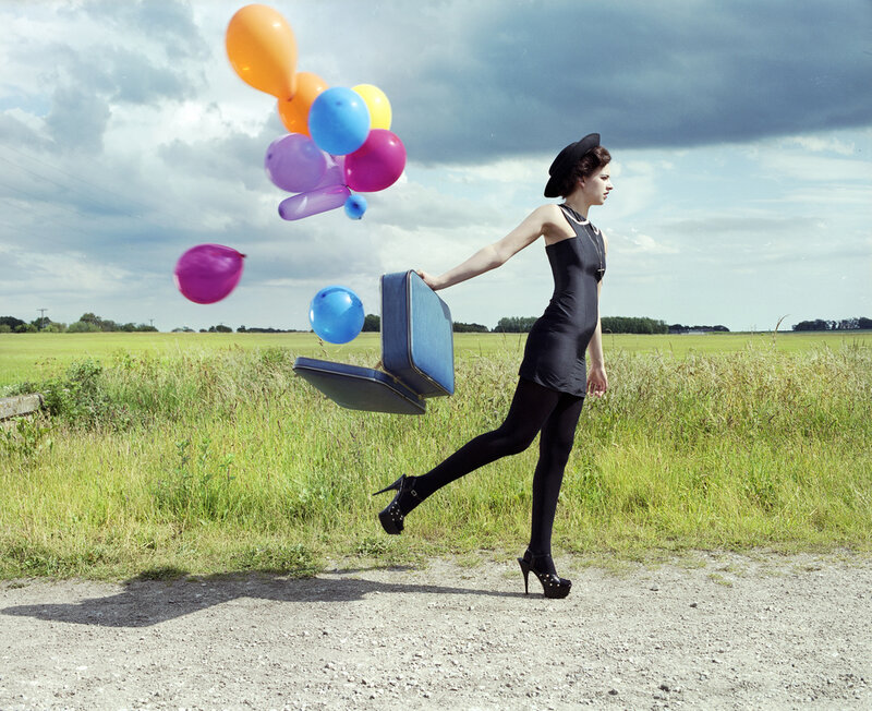 Woman with Balloons and Suitcase — Green