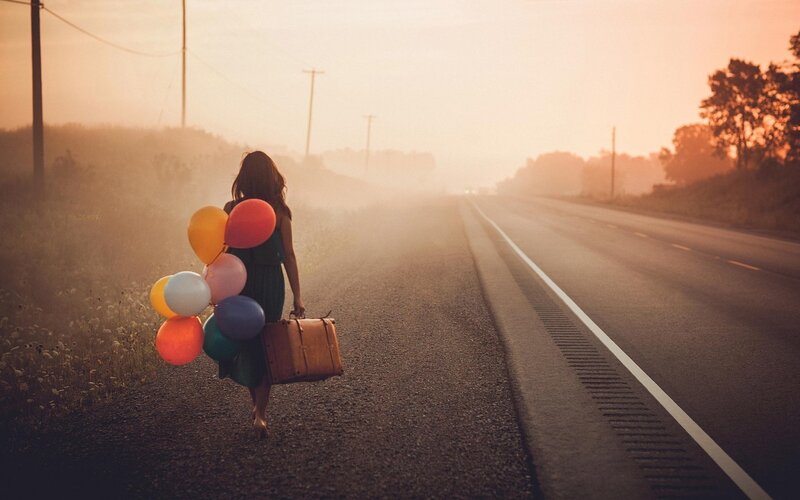 Woman with Balloons and Suitcase — Orange