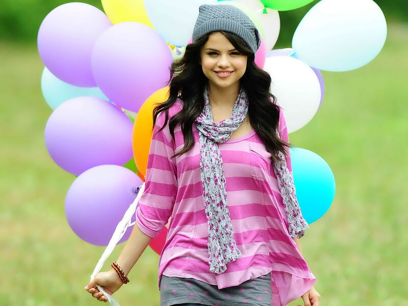 woman with balloons outdoors