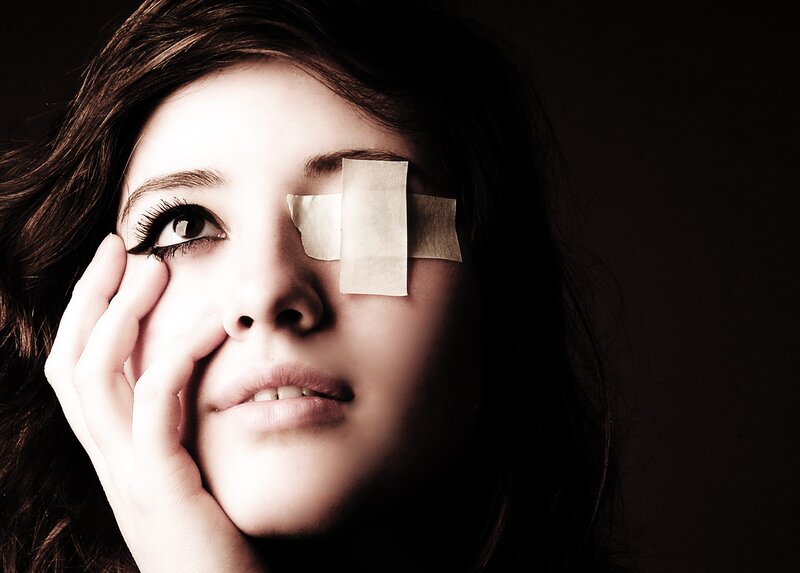 woman with bandage on eye
