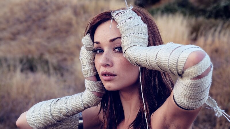 woman with bandaged arms