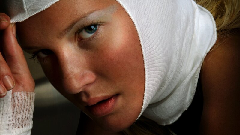 woman with bandaged head