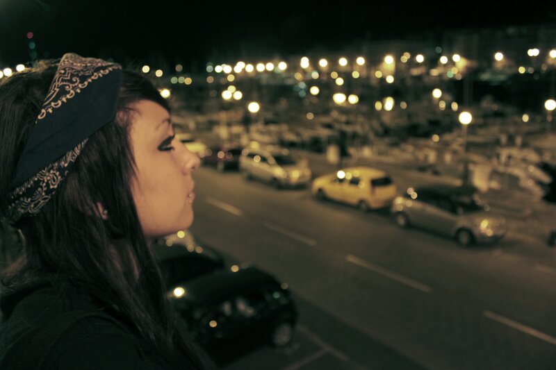 woman with bandana at night