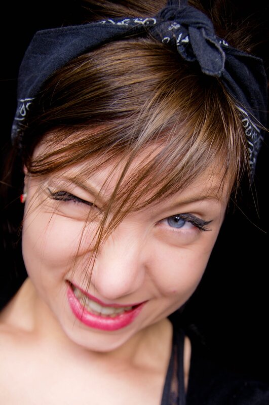 woman with bandana smiling