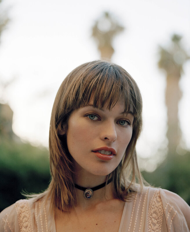 woman with bangs and choker