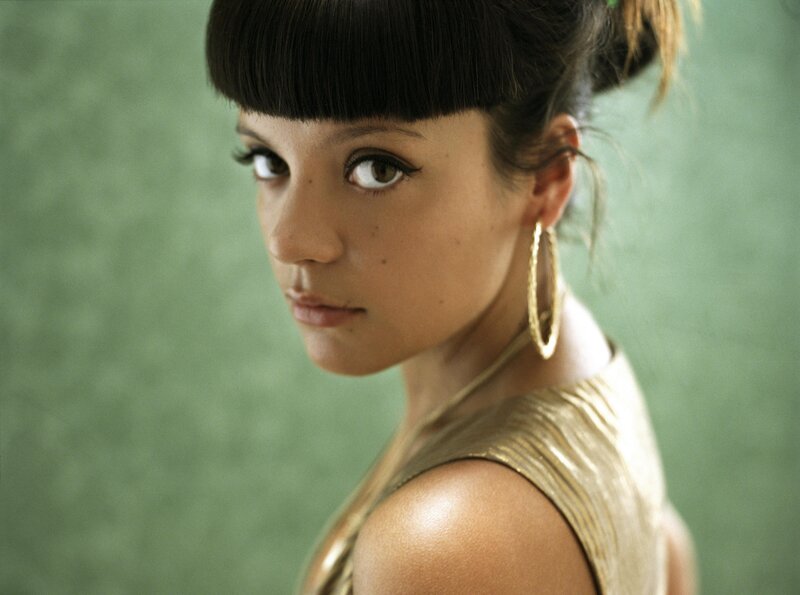 woman with bangs and gold dress