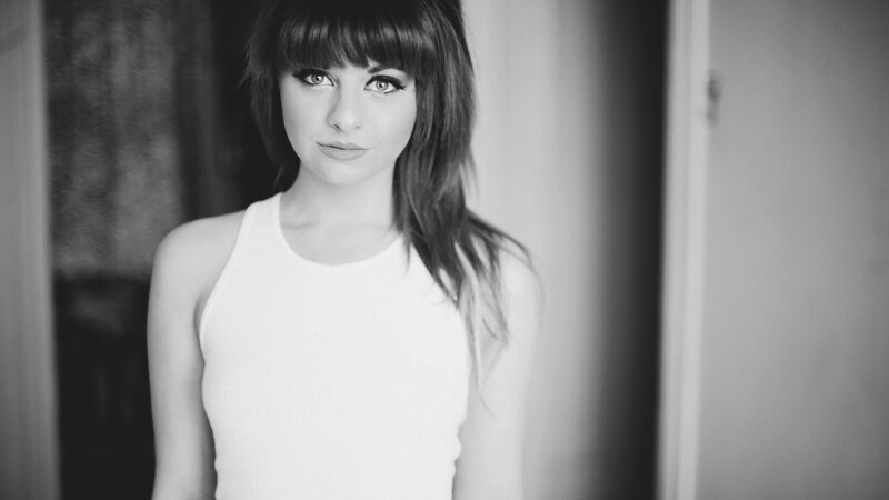 woman with bangs in black and white
