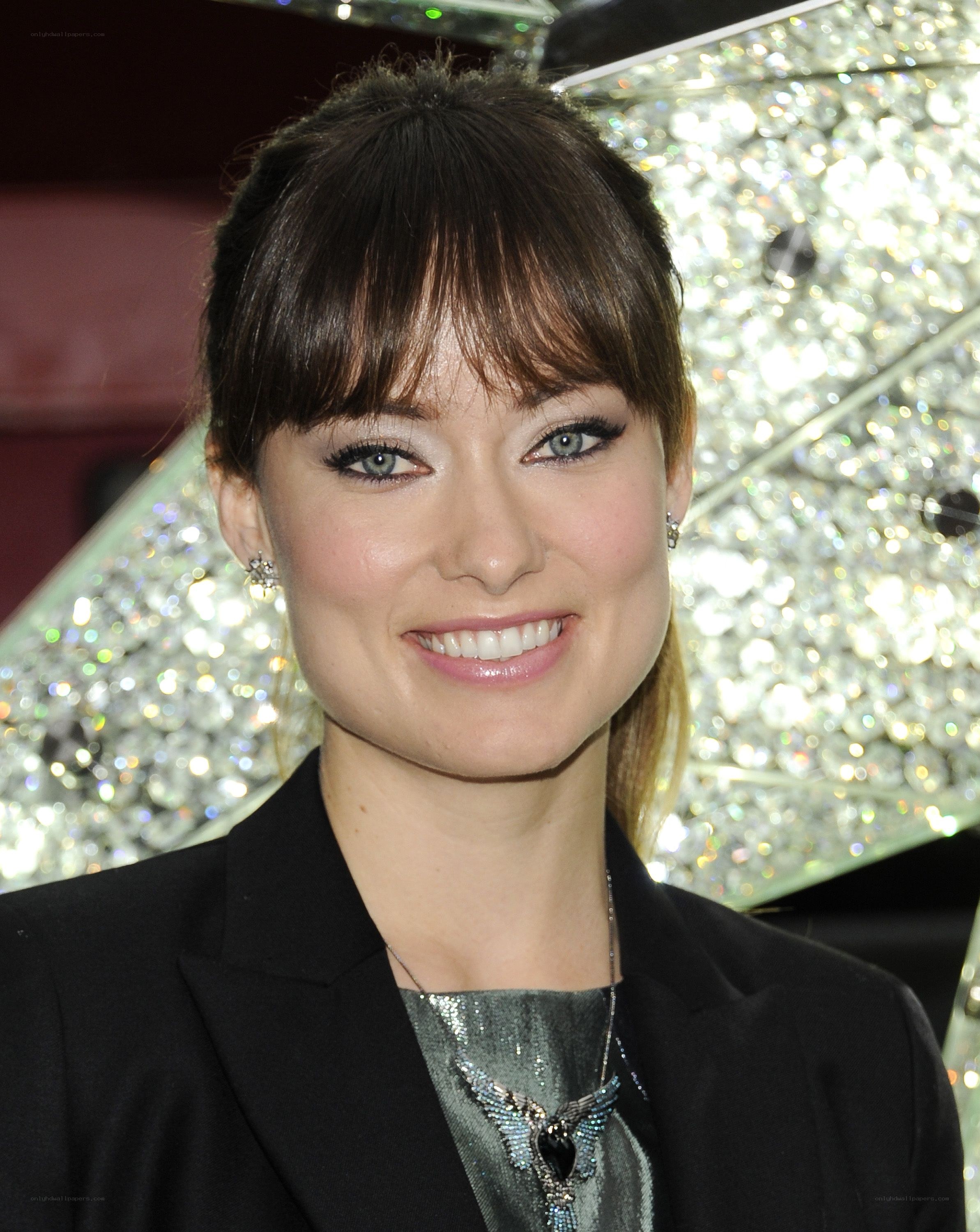 woman with bangs smiling