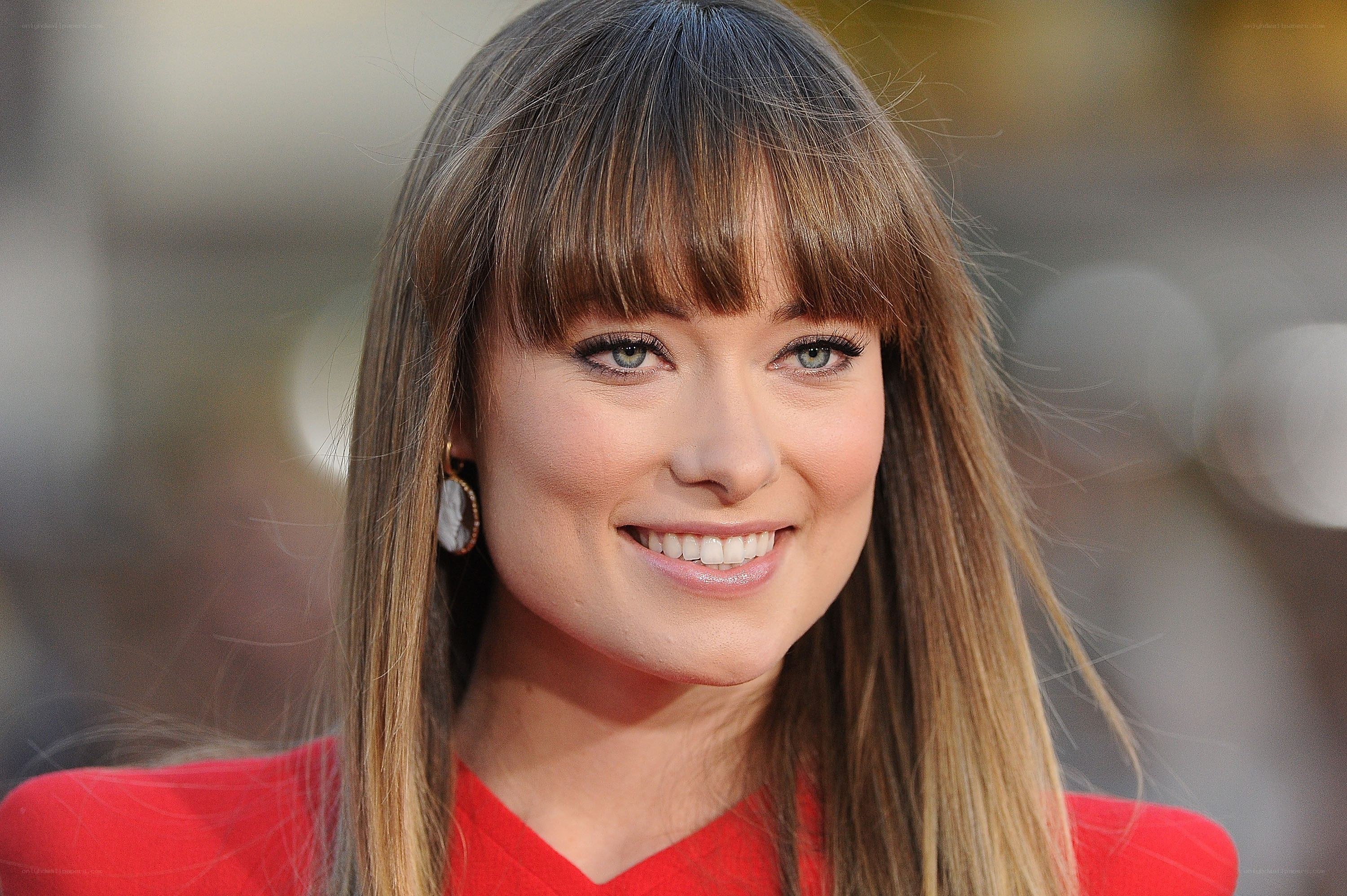 woman with bangs smiling