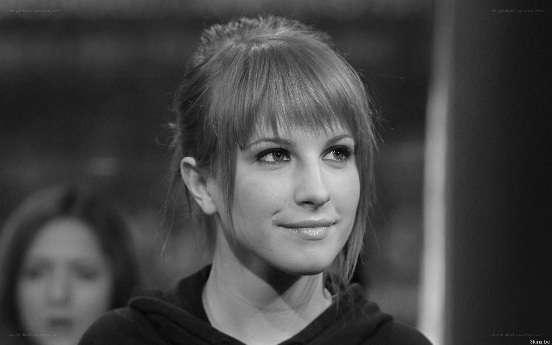 woman with bangs smiling