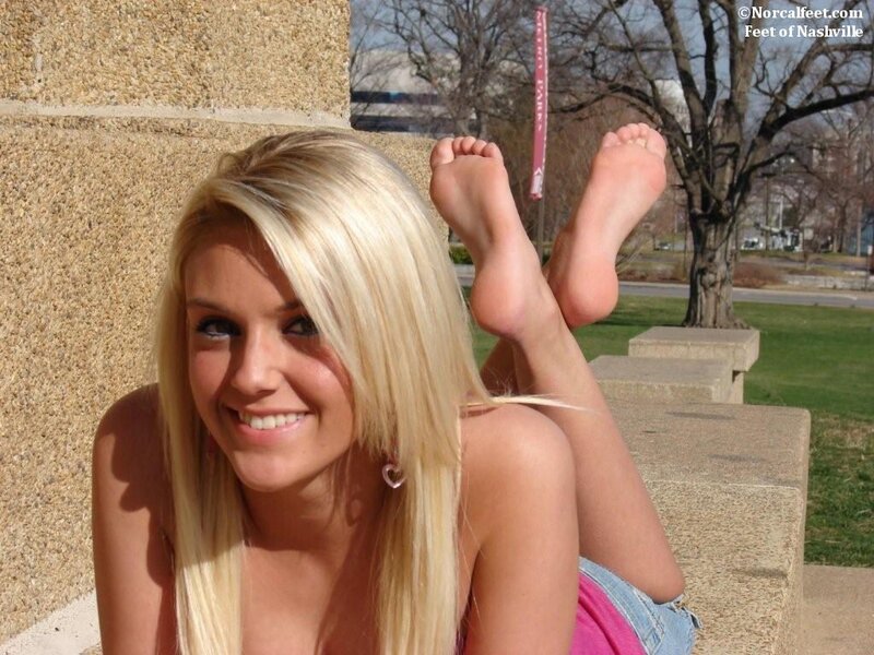 woman with bare feet smiling