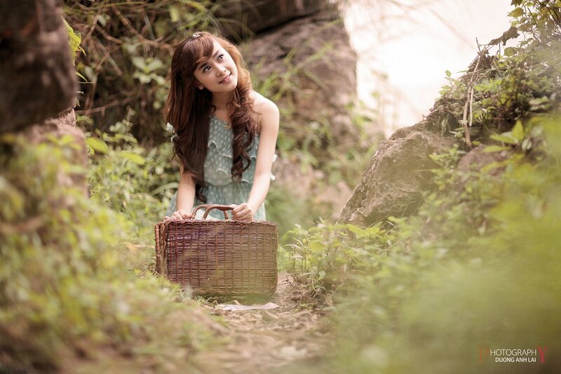Woman with basket in forest