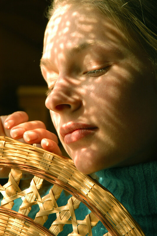 woman with basket in sunlight