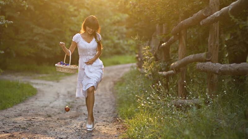 Woman with basket on path