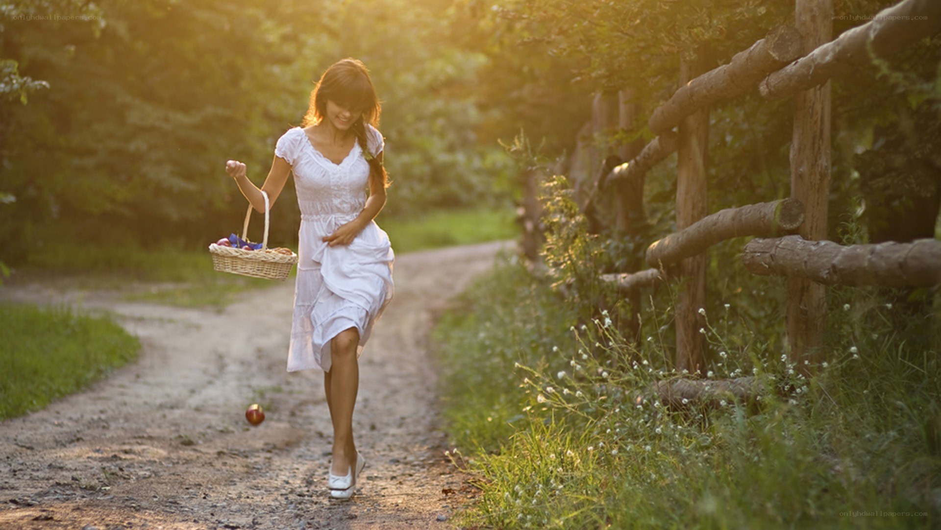 Woman with basket on path