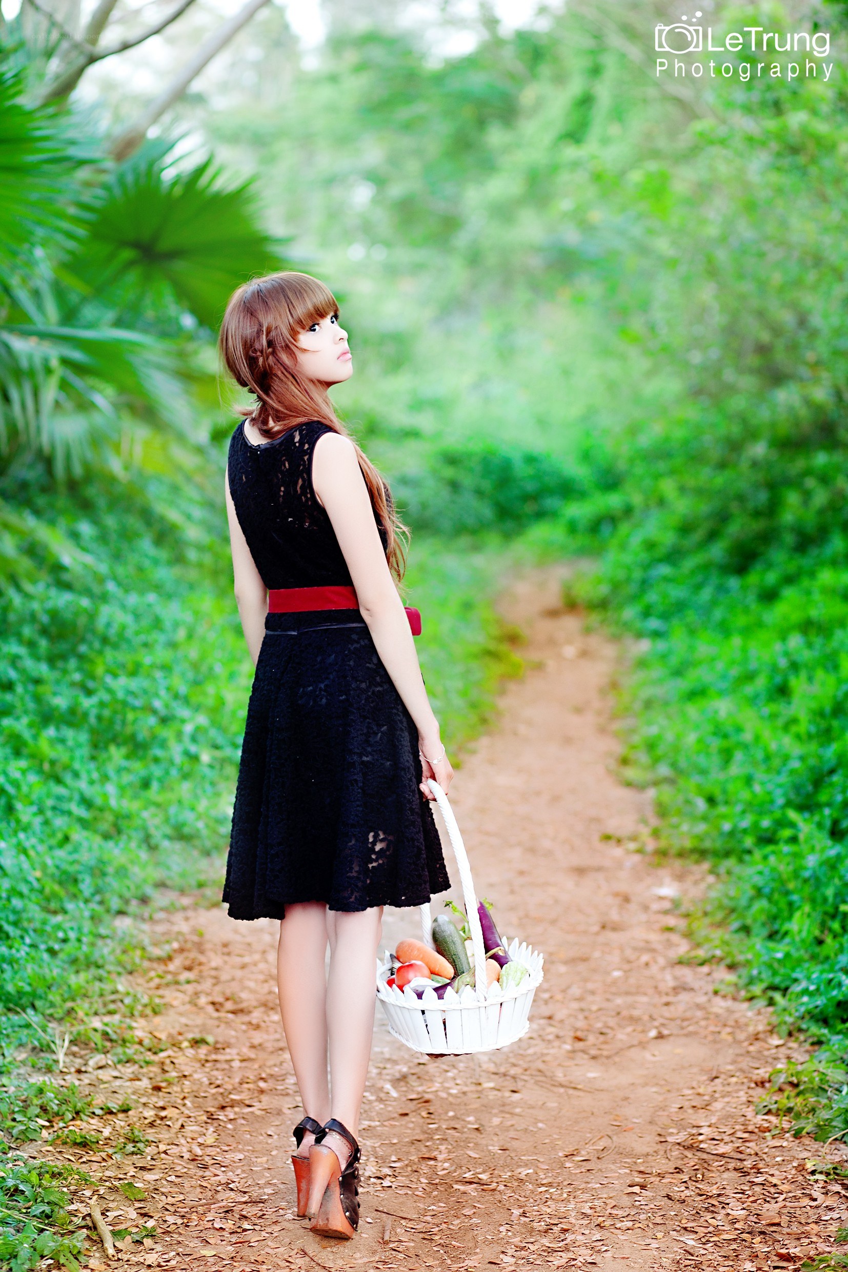 Woman with basket on path