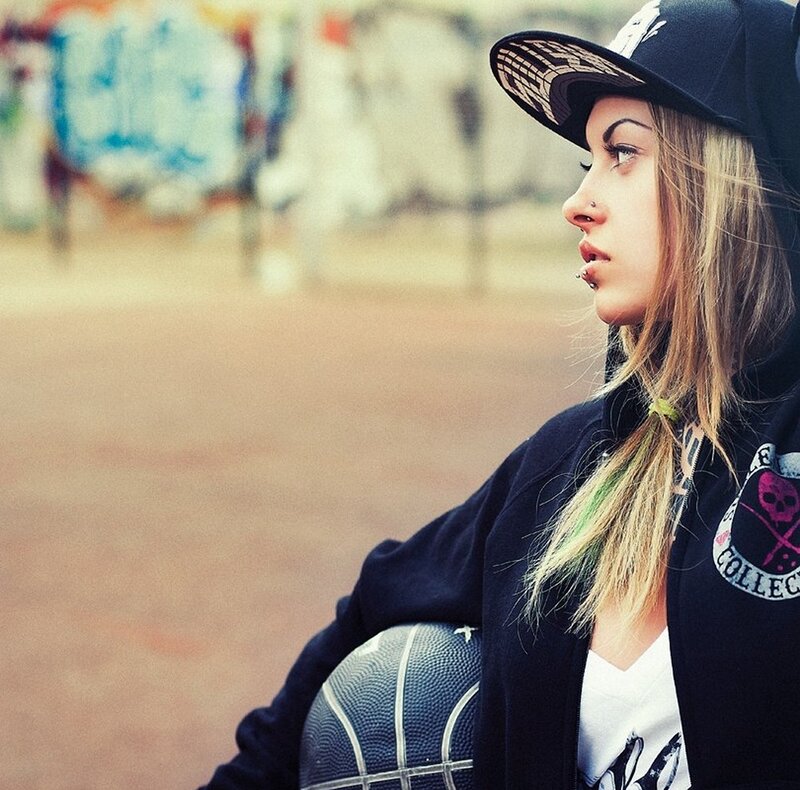 woman with basketball in urban setting