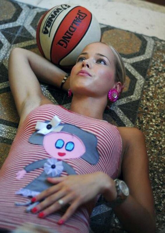 Woman with basketball on floor