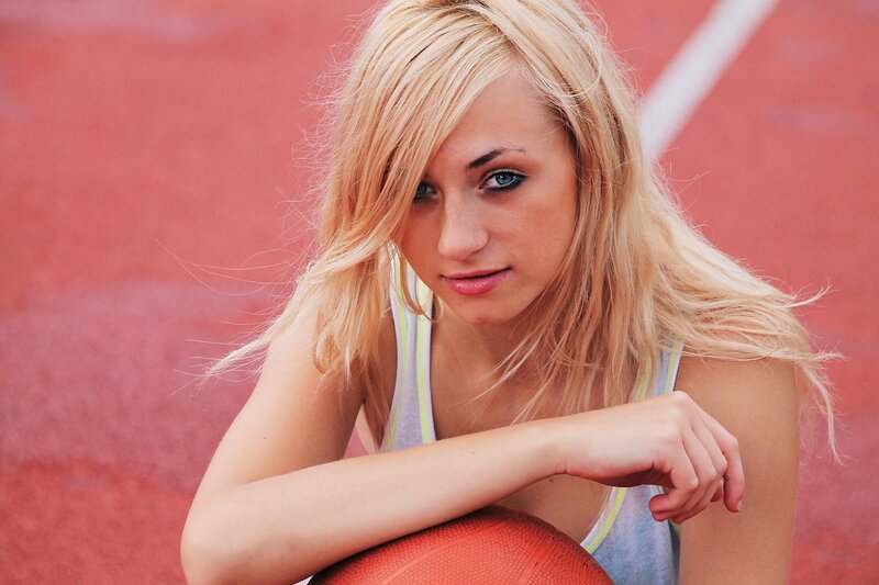 woman with basketball on track