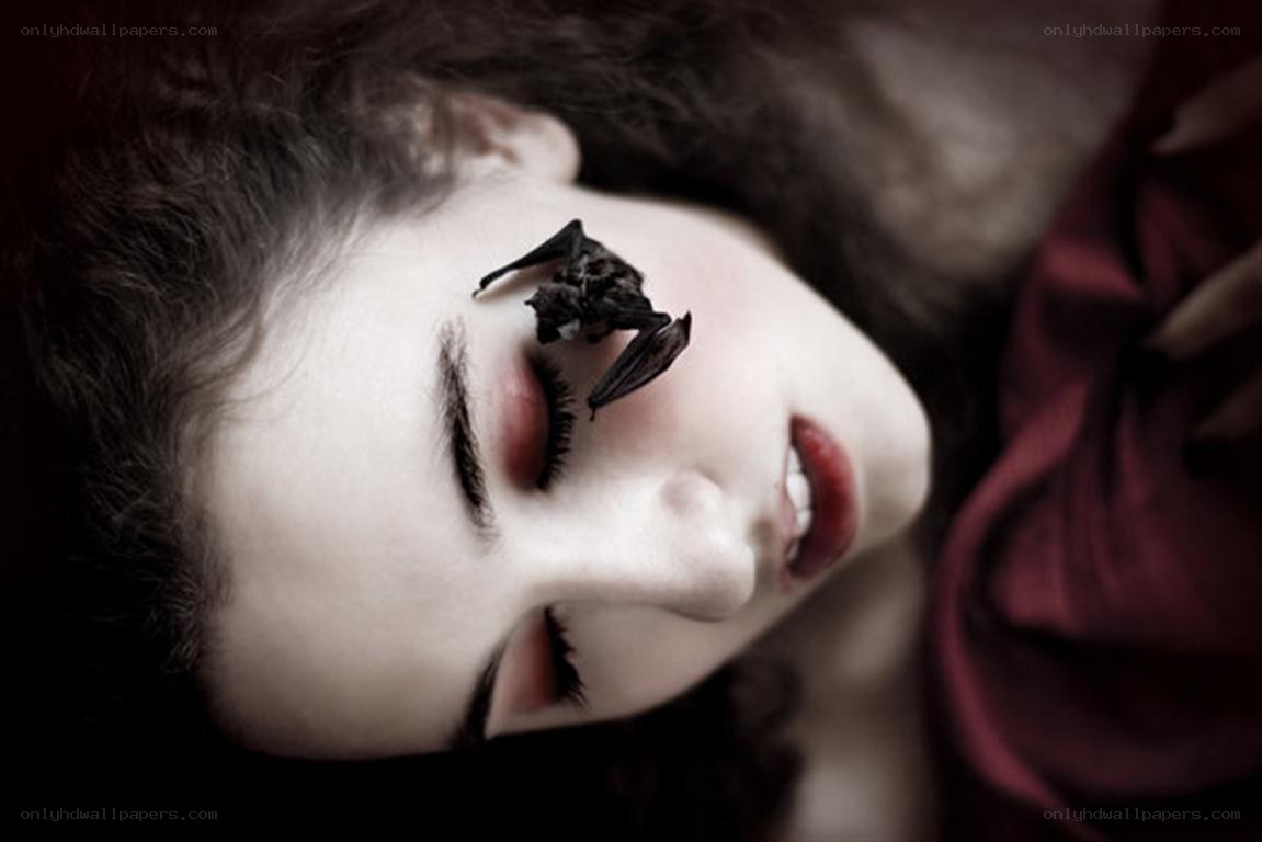 woman with bat on face