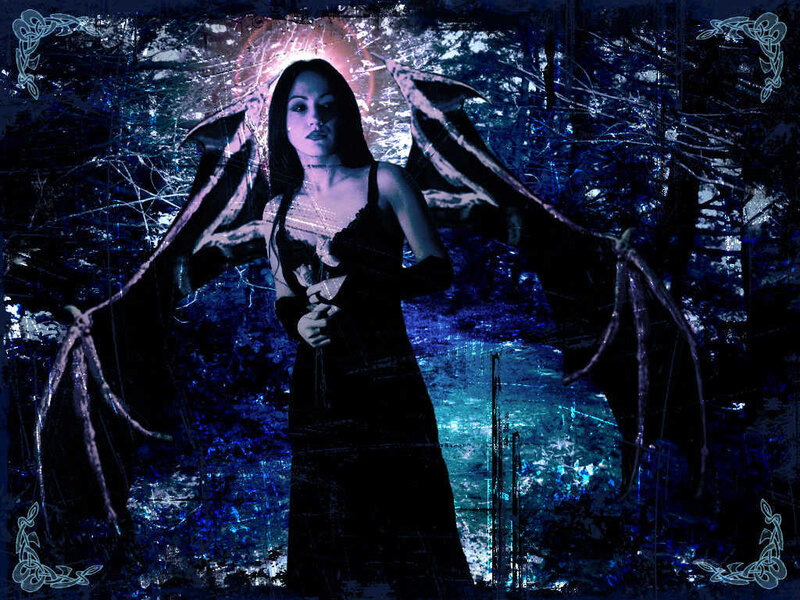 woman with bat wings in forest