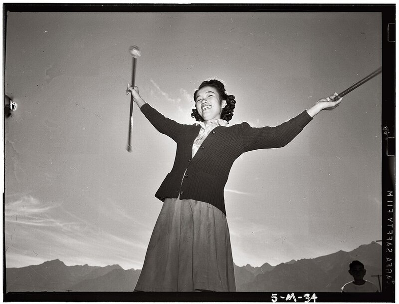 Woman with batons in mountains