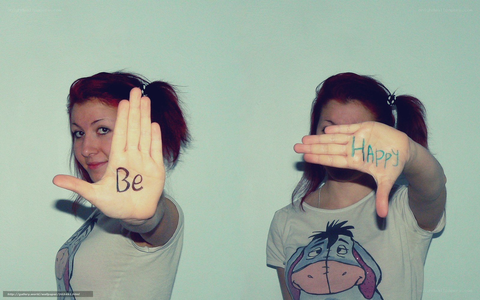 woman with 'be happy' on hands