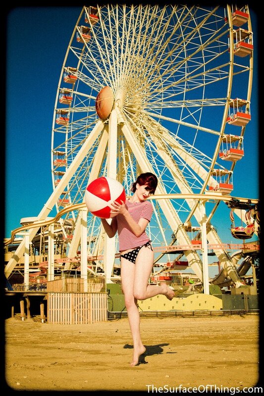 Woman with beach ball at amusement park