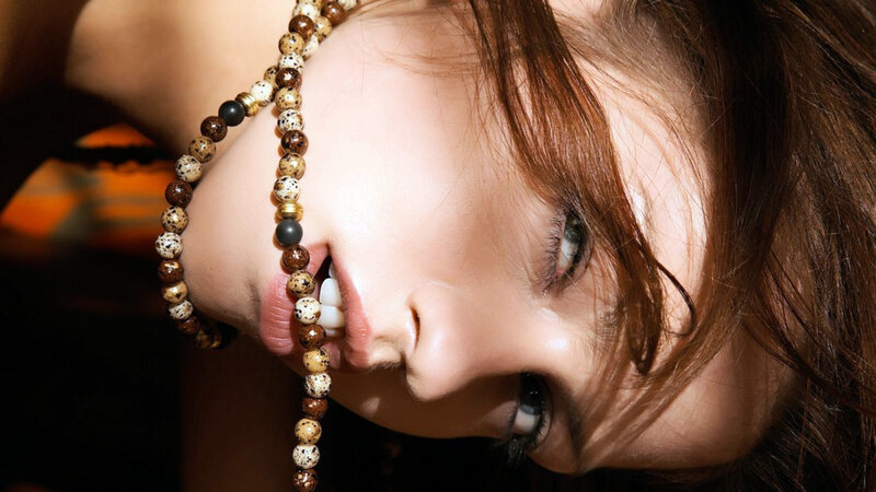 Woman with Beaded Necklace — Brown