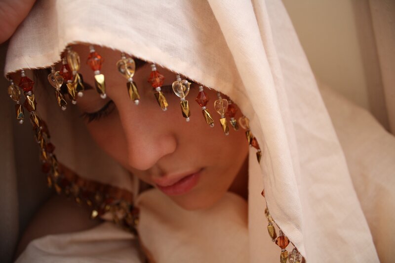 woman with beaded veil
