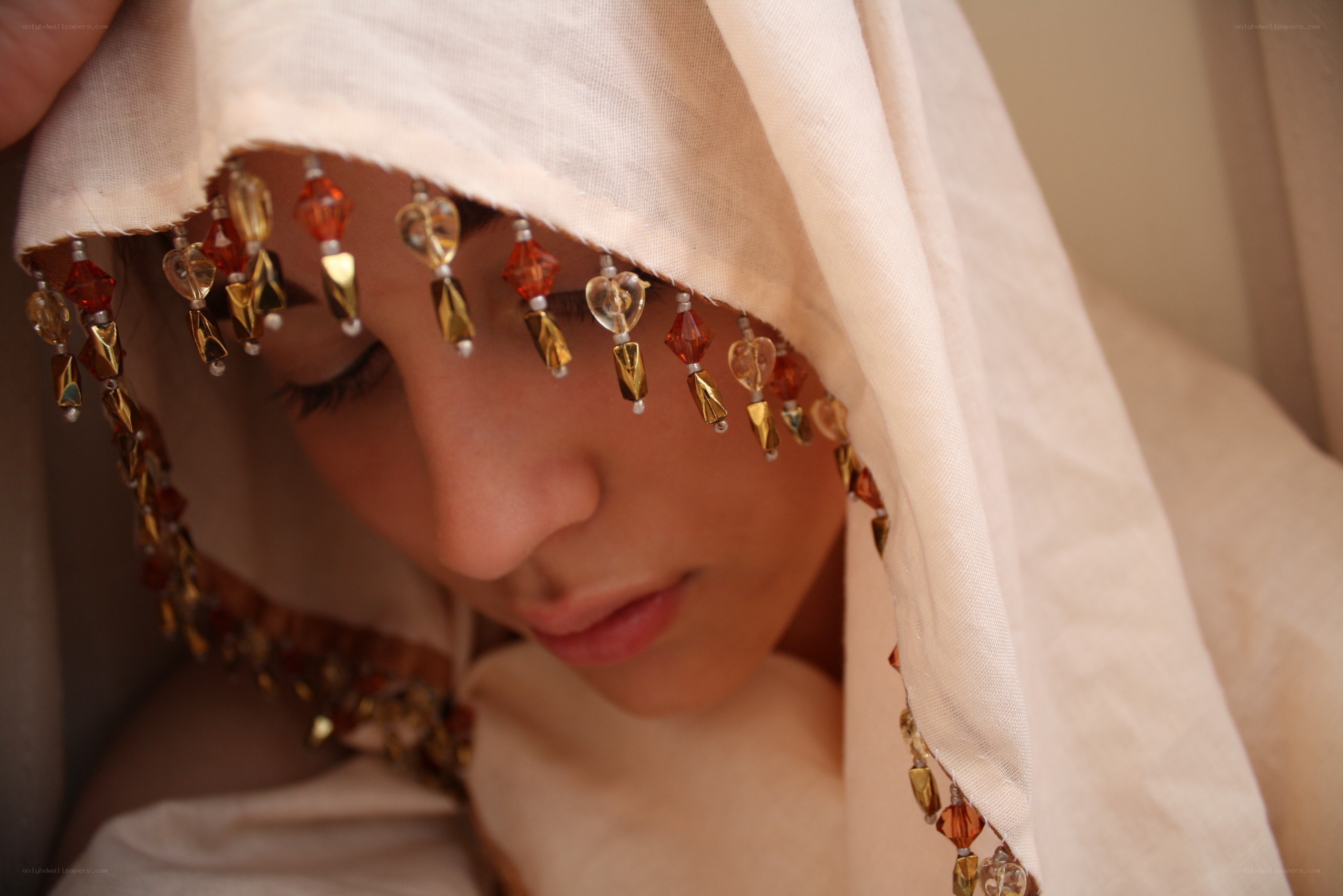 woman with beaded veil