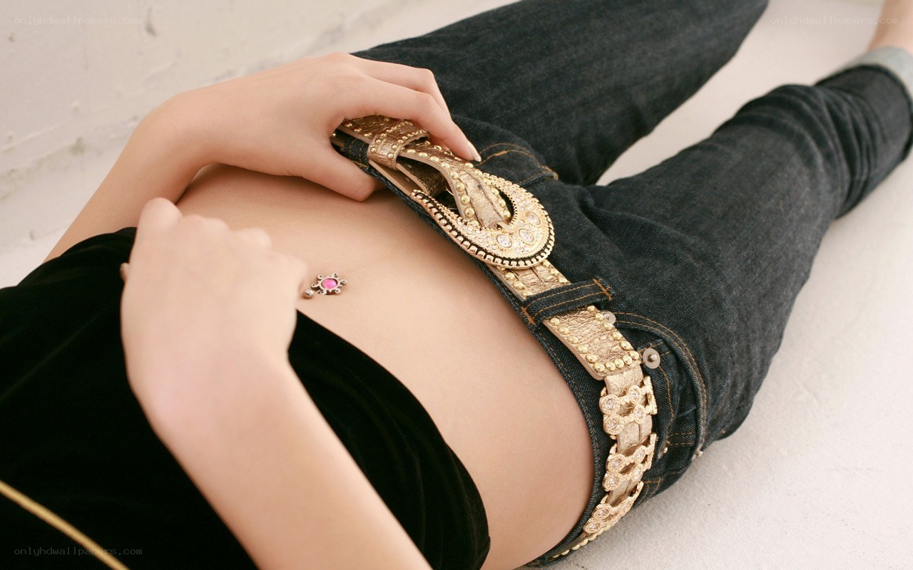 woman with belly button piercing