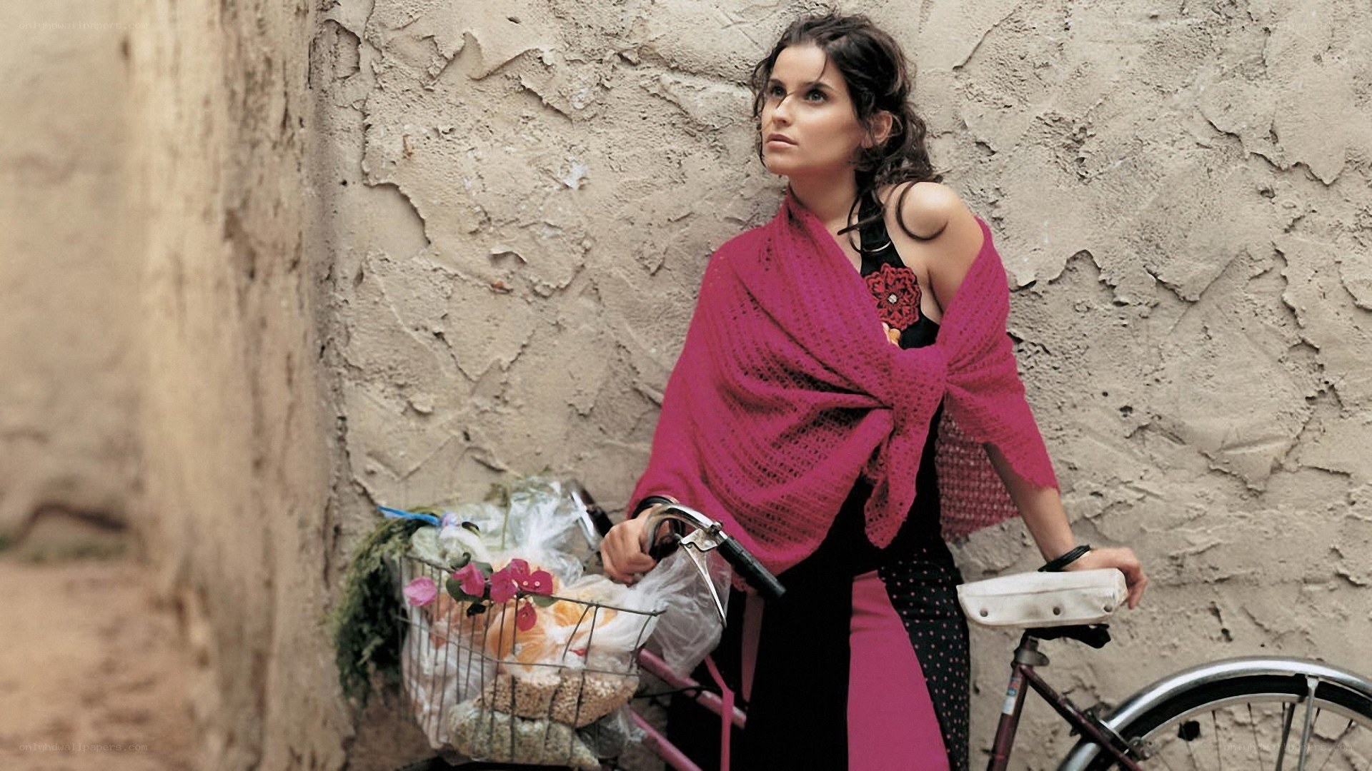 Woman with bicycle and flowers