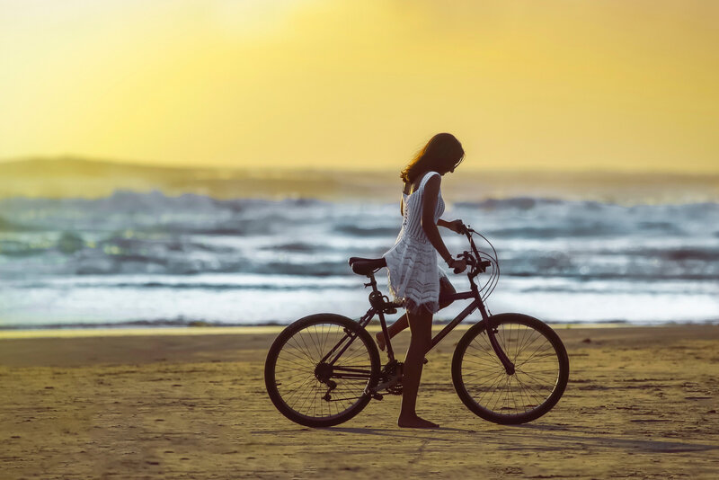 Woman with Bicycle on Beach — Yellow