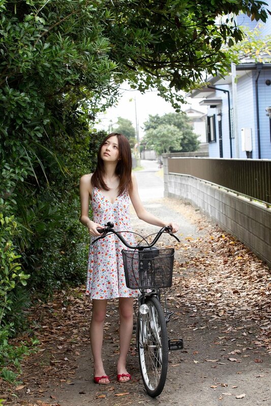 Woman with bicycle on path
