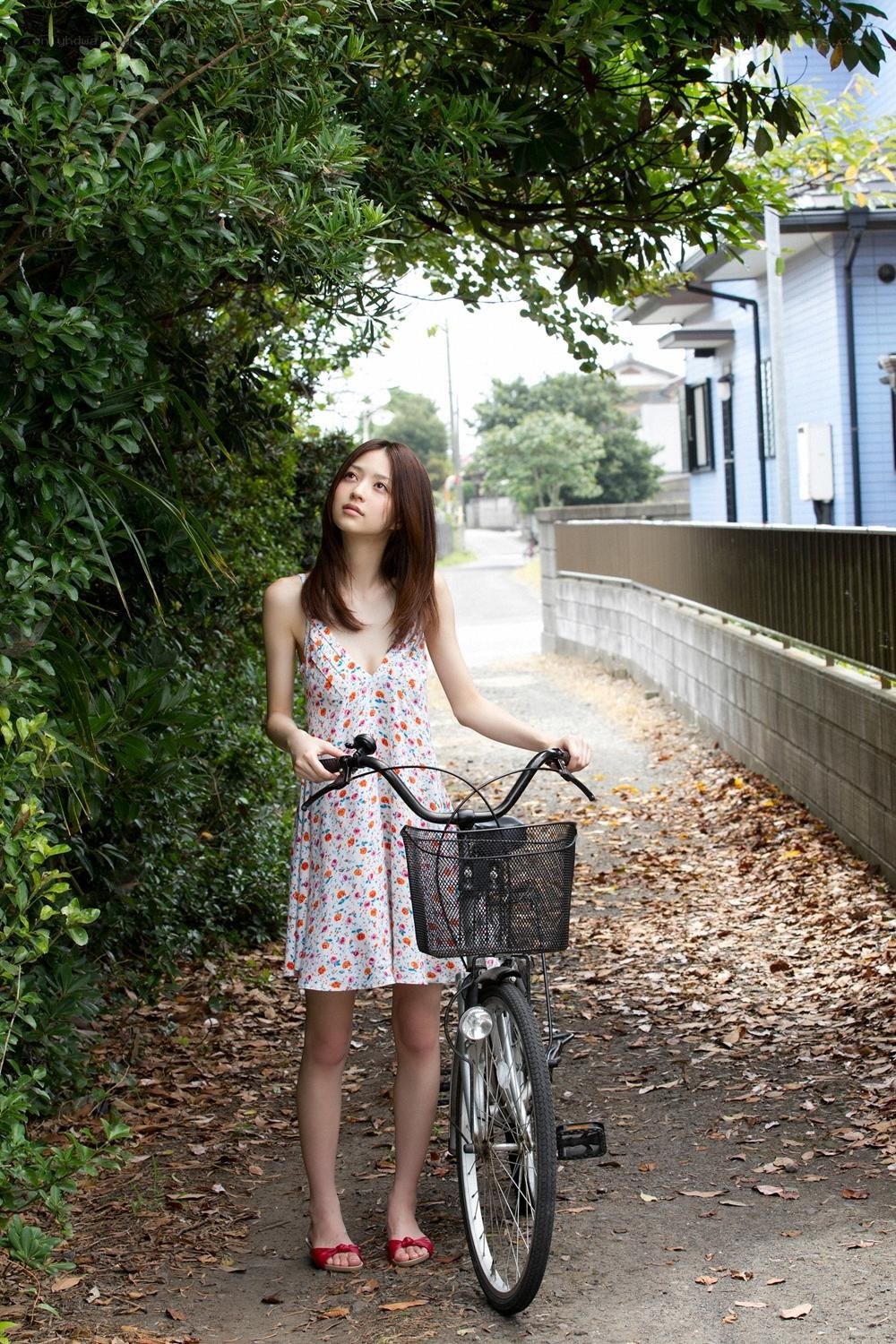 Woman with bicycle on path