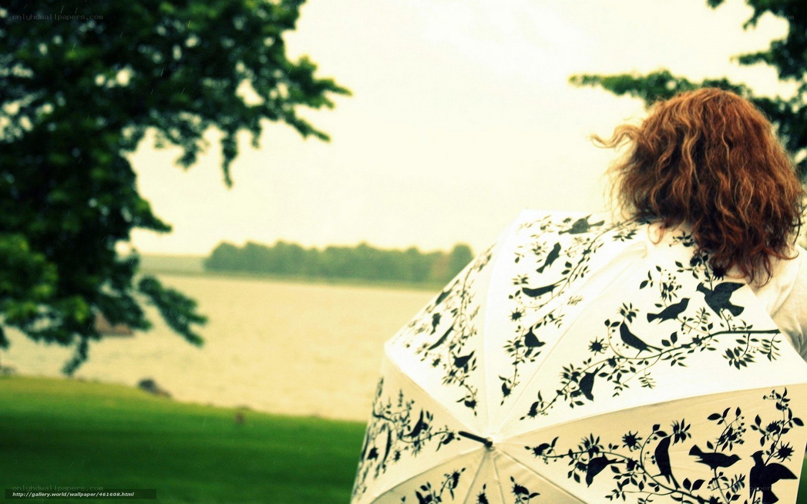 woman with bird-patterned umbrella