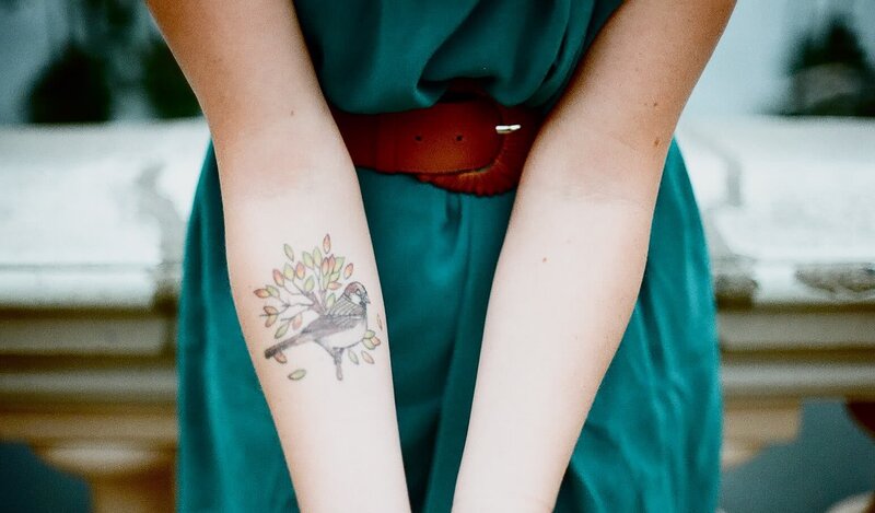 woman with bird tattoo