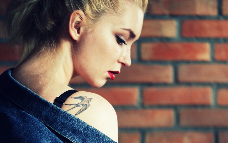 woman with bird tattoo