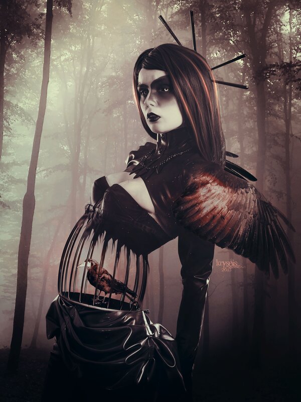 woman with birdcage in forest