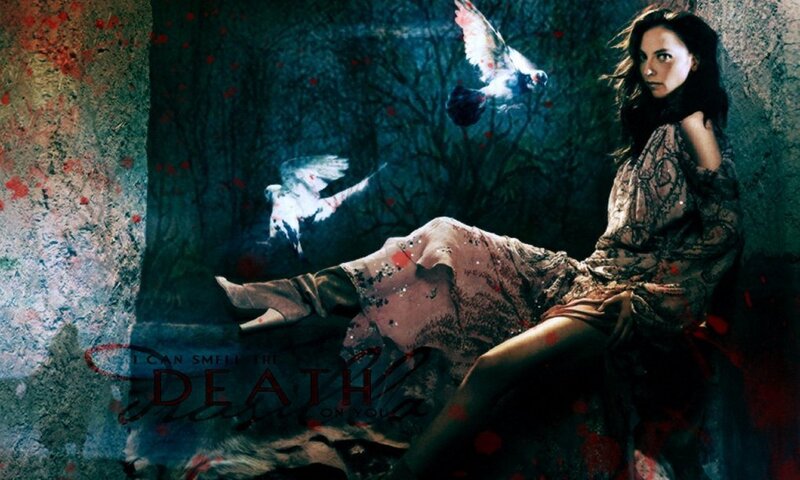 woman with birds in dark forest