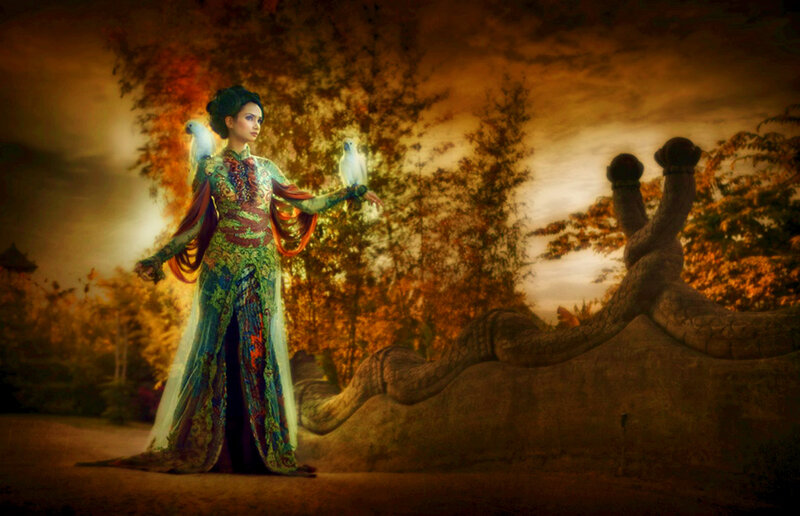 woman with birds in garden