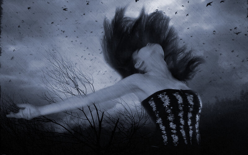 woman with birds in storm