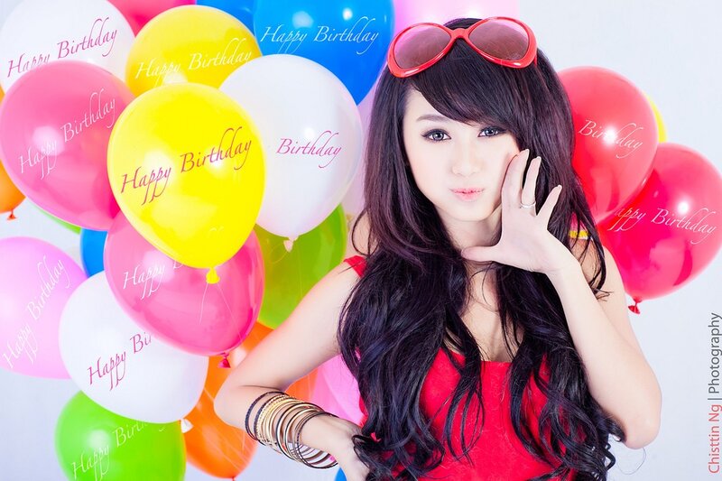 Woman with birthday balloons