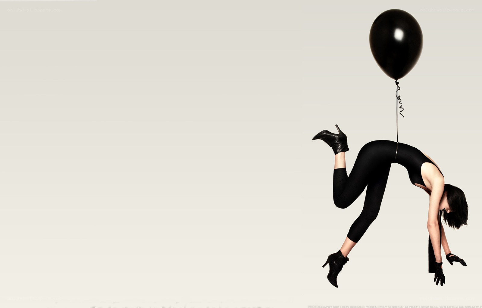 woman with black balloon