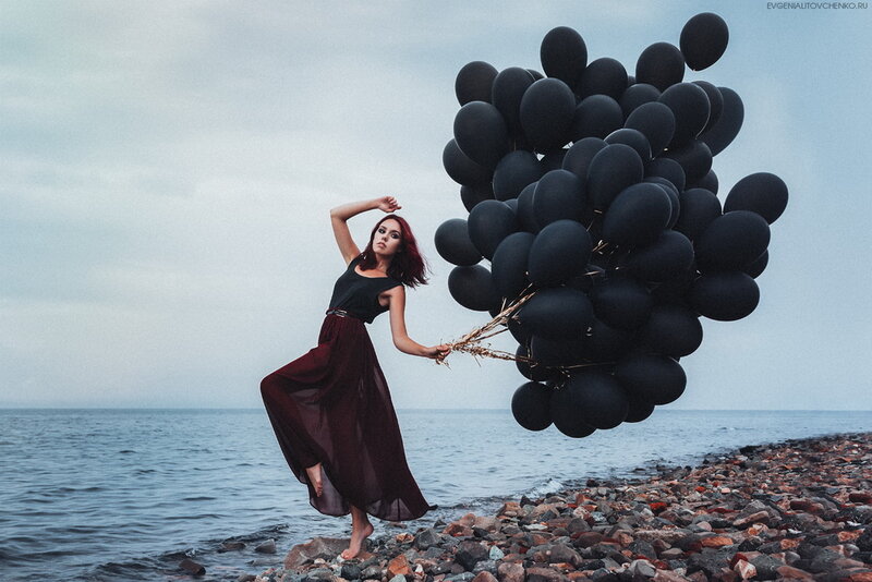 Woman with Black Balloons — Dramatic