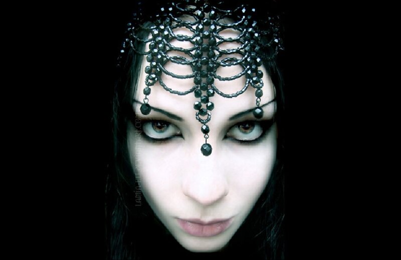 woman with black beaded headpiece